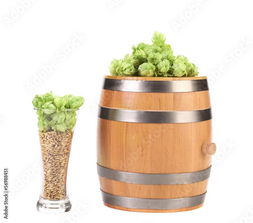 Photo: Barrel and glass with hop barley. Barrel and glass with hop barley.