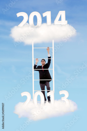 Photo: Businessman try to climb upward Businessman try to climb upward