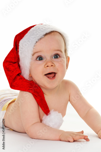 Photo: Kind mit Weihnachtsmann Mütze Kind mit Weihnachtsmann Mütze