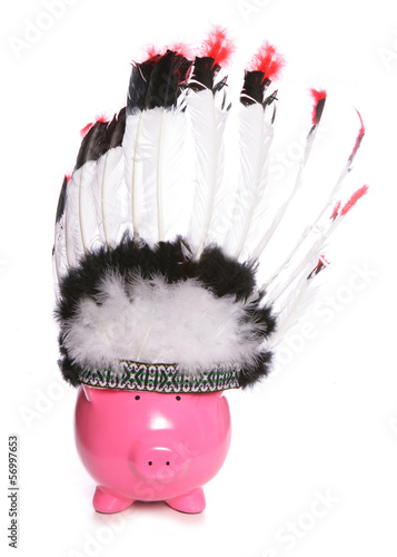 Photo: Piggy bank wearing a red indian headdress Piggy bank wearing a red indian headdress