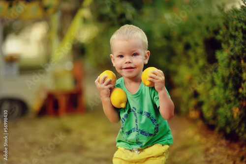Photo: on the nature of the little boy in green t-shirt with mature lem on the nature of the little boy in green t-shirt with mature lem