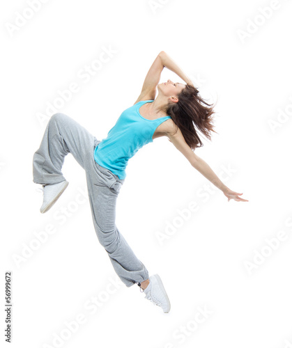 Photo: Modern teenage girl dancer jumping and dancing Modern teenage girl dancer jumping and dancing