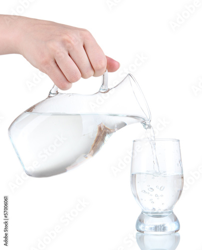 Photo: Glass pitcher of water and glass isolated on white Glass pitcher of water and glass isolated on white