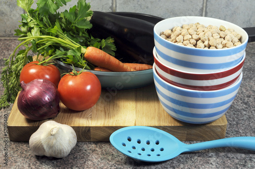 Photo: Vegetarian cooking concept with bowls of chick peas Vegetarian cooking concept with bowls of chick peas