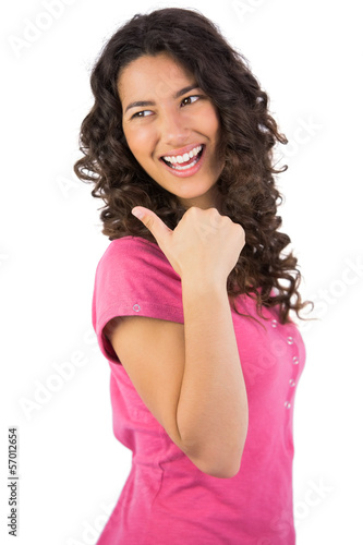 Photo: Dark haired young model posing thumb up Dark haired young model posing thumb up