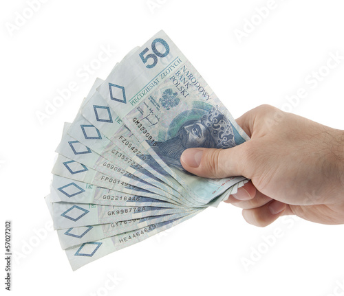 Photo: Polish money in hand. Clipping path included. Polish money in hand. Clipping path included.