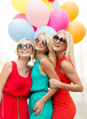Photo: beautiful girls with colorful balloons in the city beautiful girls with colorful balloons in the city