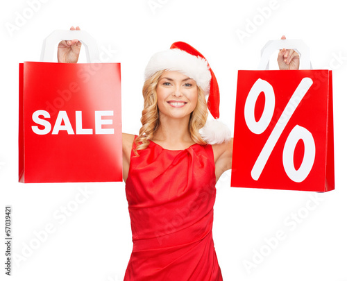Photo: woman in red dress with shopping bags woman in red dress with shopping bags