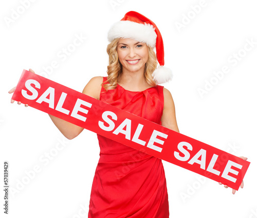 Photo: woman in santa helper hat with red sale sign woman in santa helper hat with red sale sign