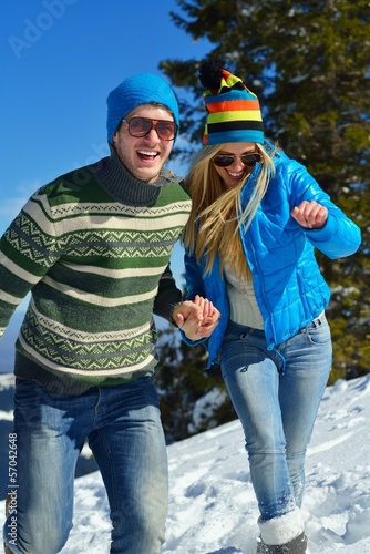 Photo: Young Couple In Winter Snow Scene Young Couple In Winter Snow Scene