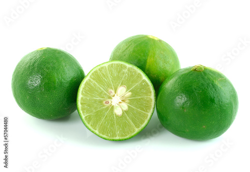 Photo: green lemon on white background green lemon on white background