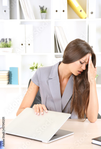 Photo: Young business woman in office Young business woman in office