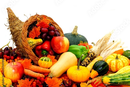 Photo: Harvest cornucopia filled with assorted vegetables and fruit Harvest cornucopia filled with assorted vegetables and fruit