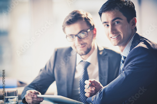 Photo: Businessmen at meeting Businessmen at meeting