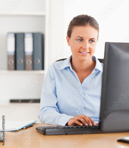 Photo: Close up of an office worker typing on a keyboard Close up of an office worker typing on a keyboard