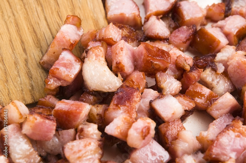 Photo: Macro photo of bacon being fried in a pan Macro photo of bacon being fried in a pan