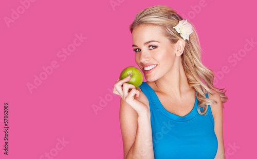 Photo: Beautiful healthy young woman with an apple Beautiful healthy young woman with an apple