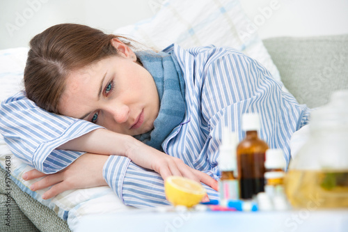Photo: Sick woman lying in bed Sick woman lying in bed