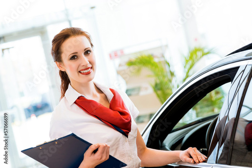Photo: young woman in a showroom consultant young woman in a showroom consultant