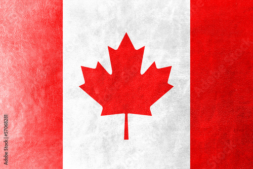 Photo: Canada Flag painted on leather texture Canada Flag painted on leather texture