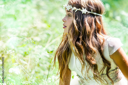 Photo: Cute girl wearing headband in field. Cute girl wearing headband in field.