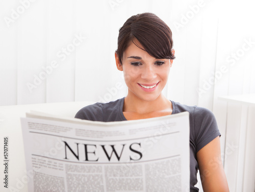 Photo: Woman Reading Newspaper Woman Reading Newspaper