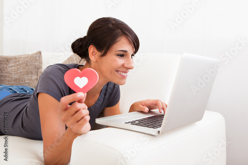 Photo: Woman With Heart Shape And Laptop Woman With Heart Shape And Laptop