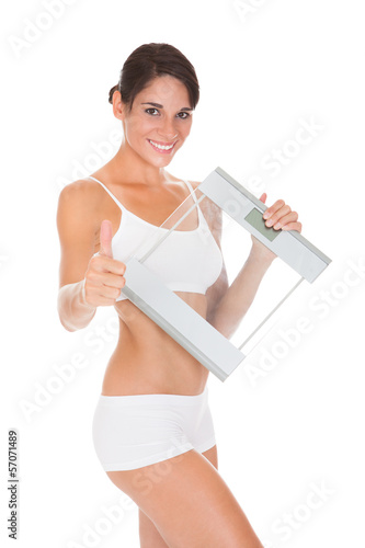 Photo: Young Woman With Weights Young Woman With Weights