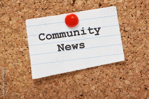 Photo: Community News paper note on a cork notice board Community News paper note on a cork notice board