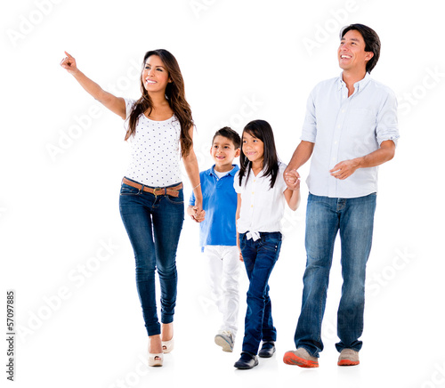 Photo: Family walking an pointing away Family walking an pointing away