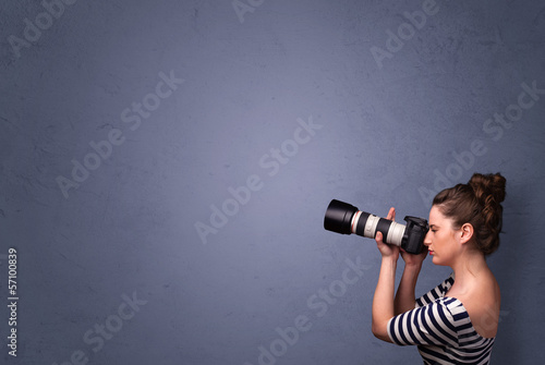 Photo: Photographer shooting images with copyspace area Photographer shooting images with copyspace area