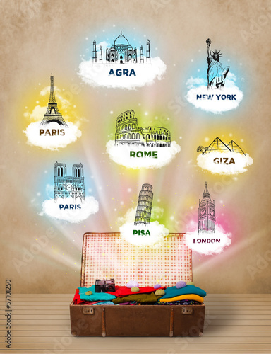 Photo: Tourist suitcase with famous landmarks around the world Tourist suitcase with famous landmarks around the world