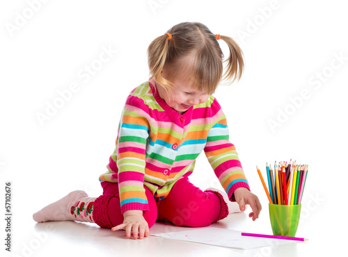 Photo: child drawing with colorful pencils child drawing with colorful pencils