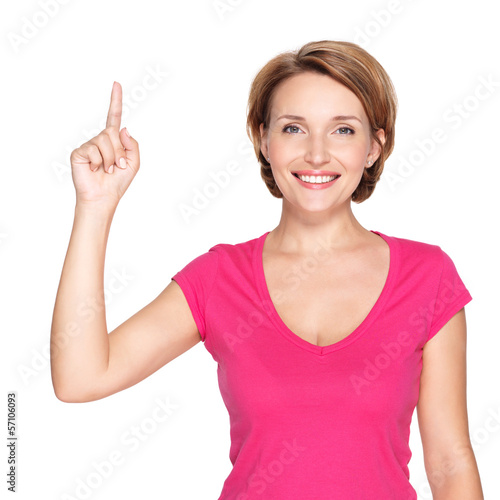 Photo: happy woman pointing up with her finger happy woman pointing up with her finger