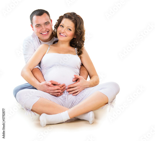 Photo: Happy Couple Expecting Baby. Isolated on White Background Happy Couple Expecting Baby. Isolated on White Background
