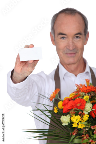 Photo: Florist showing business card Florist showing business card