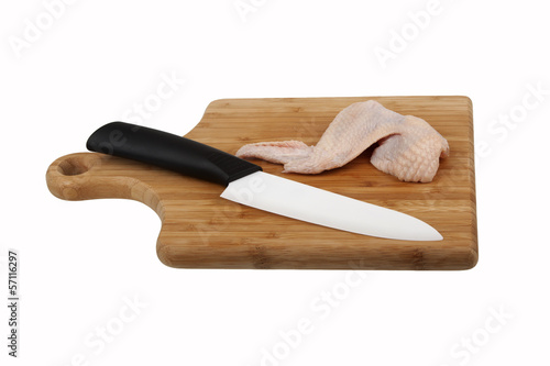 Photo: Chicken wing and knife Chicken wing and knife