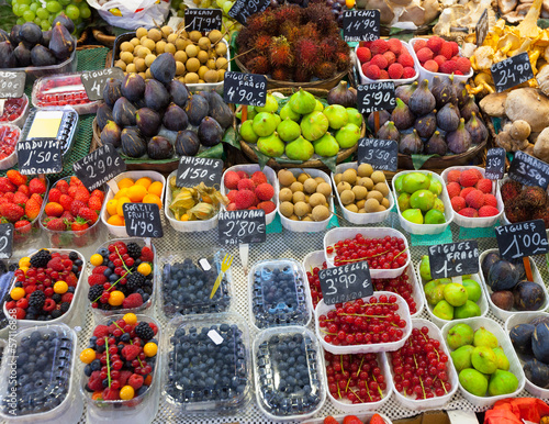 Photo: Exotic fruits and berries on counter Exotic fruits and berries on counter