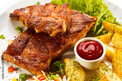 Photo: Tasty grilled ribs with vegetables Tasty grilled ribs with vegetables