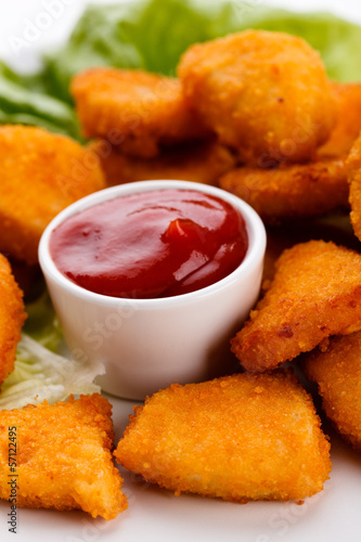 Photo: Chicken nuggets on white background Chicken nuggets on white background