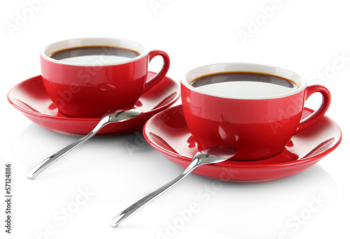 Photo: Red cups of strong coffee isolated on white Red cups of strong coffee isolated on white