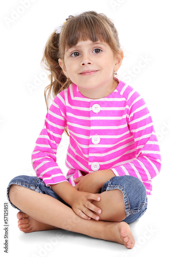 Photo: Little girl sitting on floor isolated on white Little girl sitting on floor isolated on white