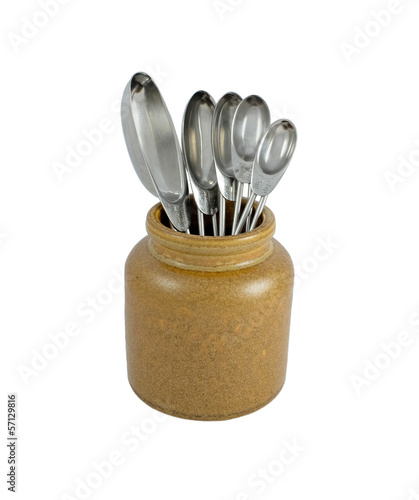 Photo: Metal measuring spoons in a ceramic pot Metal measuring spoons in a ceramic pot