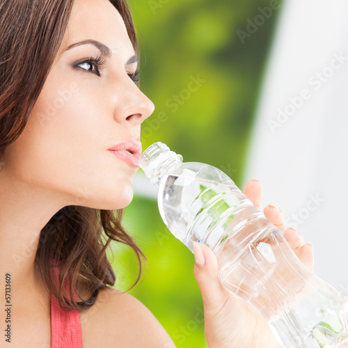 Photo: Young woman with water, outdoors Young woman with water, outdoors