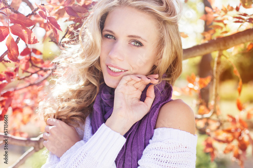 Photo: beautifull young girl near colourful tree beautifull young girl near colourful tree