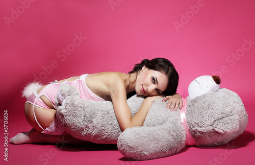 Photo: Tenderness. Sentiment. Daydreaming Woman with Teddy Bear Laying Tenderness. Sentiment. Daydreaming Woman with Teddy Bear Laying