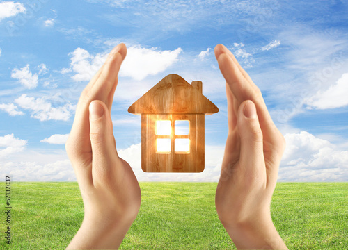 Photo: hands holding home hands holding home