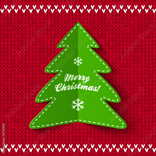 Vector: Green Christmas tree on red knitted background Green Christmas tree on red knitted background