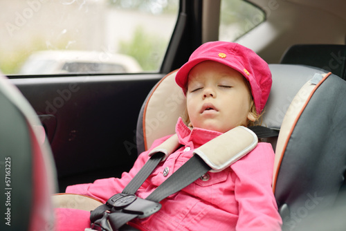 Photo: girl sleeping in car seat girl sleeping in car seat