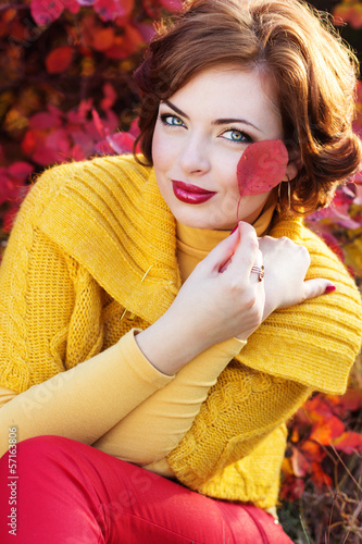 Photo: Pretty woman in autumn park Pretty woman in autumn park